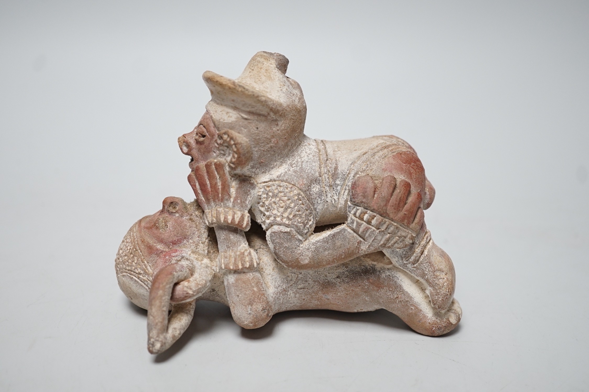 A Mayan or later biscuit earthenware erotic novelty whistle, 12cm long